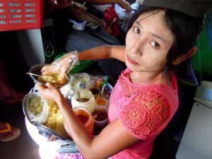Woman selling vegetable noodles on the train
