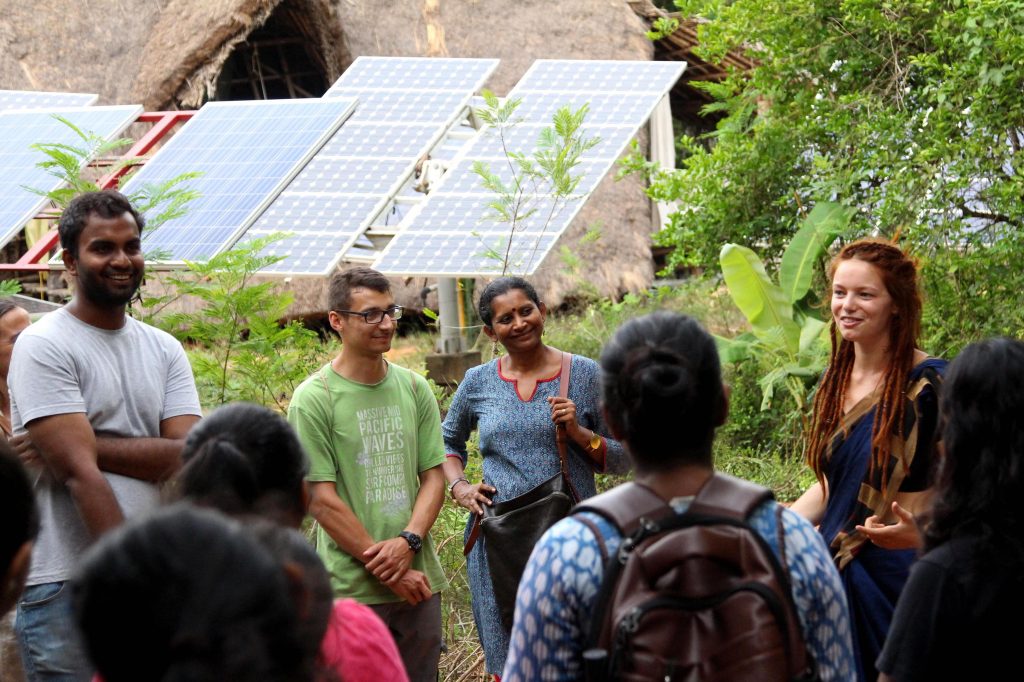 Volunteers and guests at Sadhana Forest, a vegan community in South India.